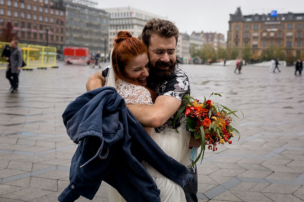 friends congratulating bride and groom after the wedding at Copenhagen city Hall