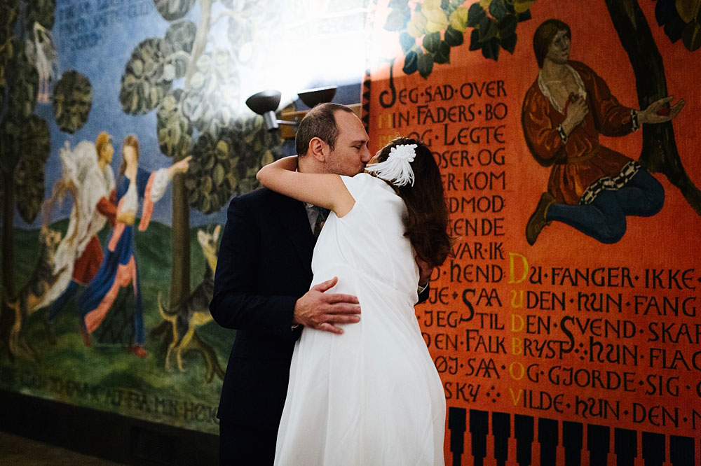 bride and groom kissing at their civil wedding ceremony at Copenhagen city hall