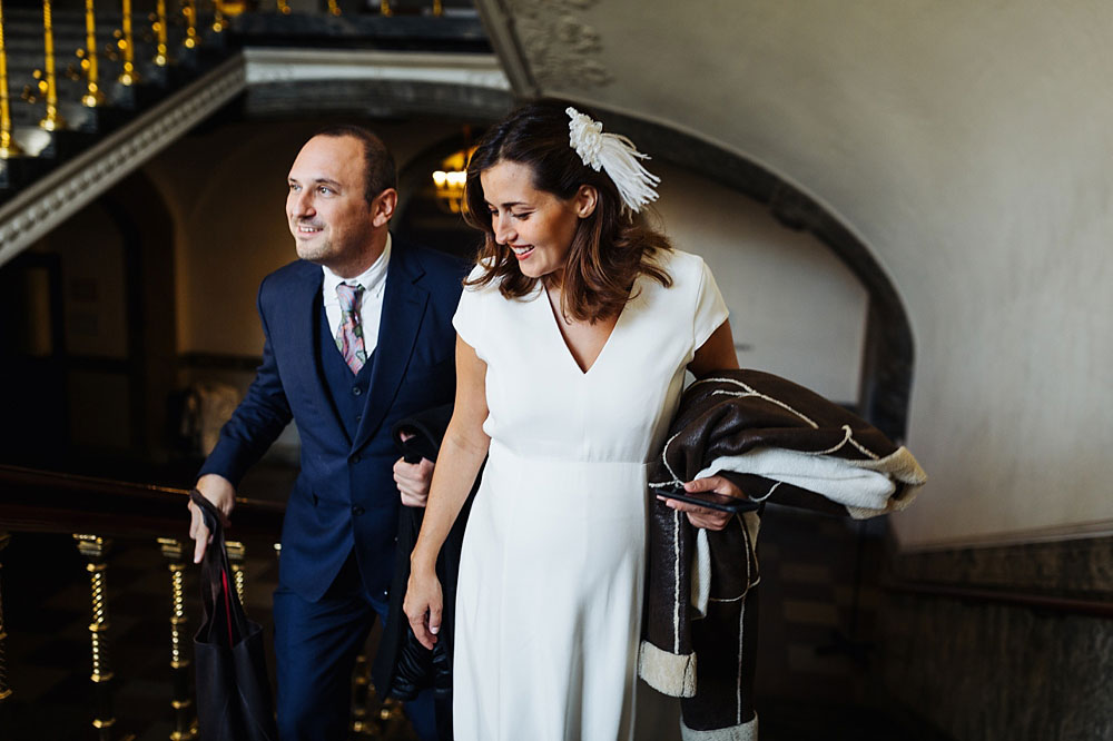 bride and groom exploring Copenhagen city Hall 