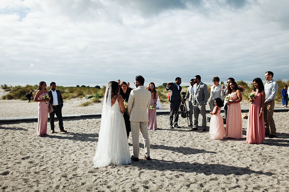 bride and groom at civil wedding ceremony at Amager Strand in Copenhagen