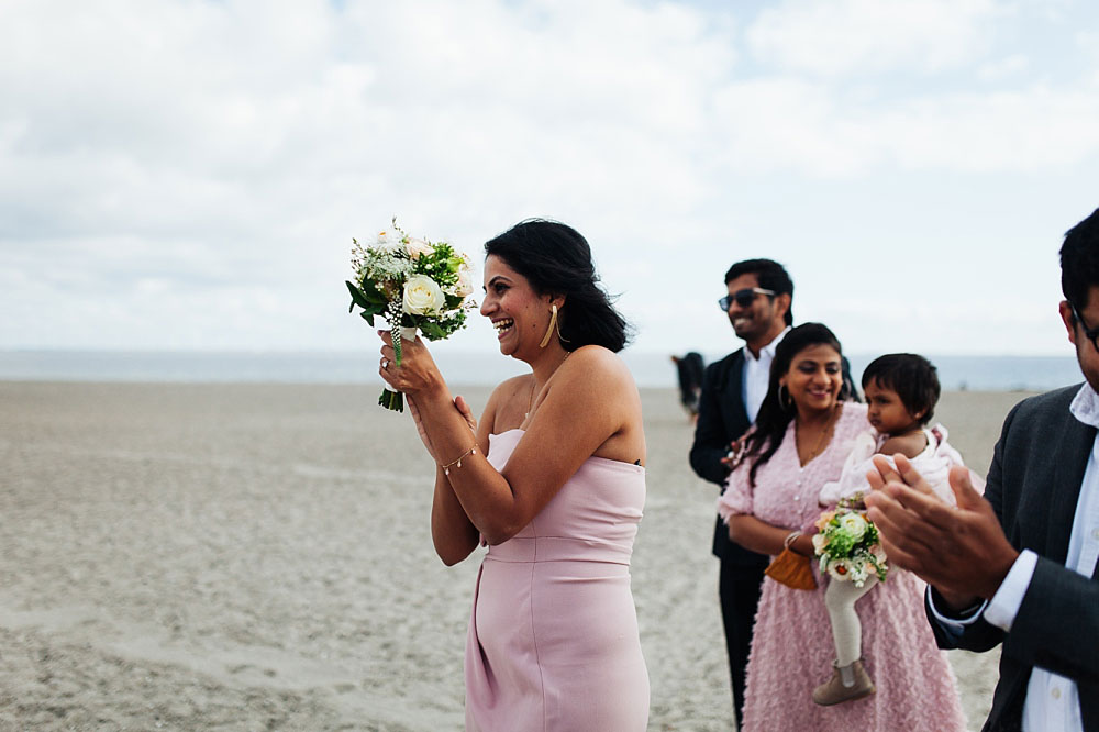 guests clapping at a beach wedding in Copenhagen