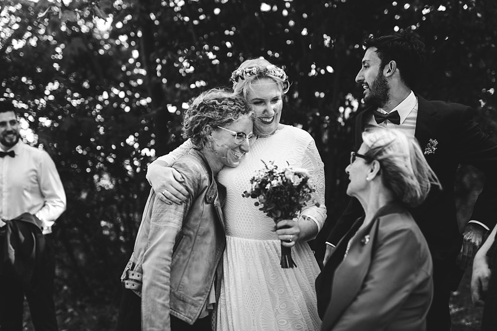 bride hugging guest at a wedding reception in Stevns Klint, Denmark