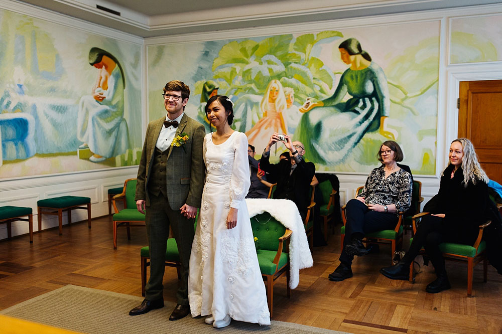 Civil wedding ceremony at Frederiksberg Town Hall. Bride, groom and guests at the wedding room.