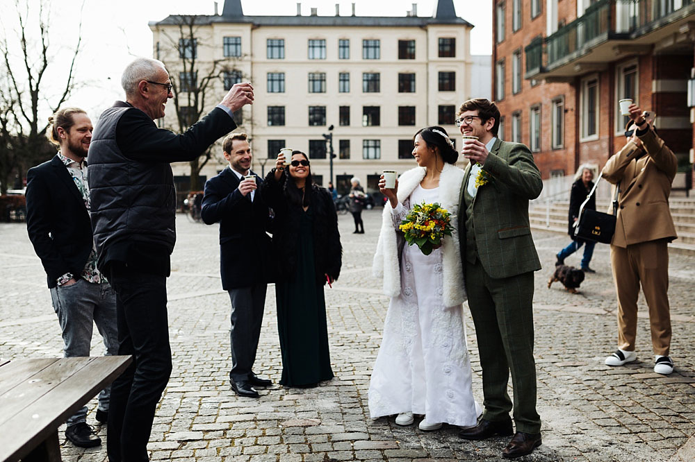 bride, groom and guests toasting at Frederiksberg Town Hall.