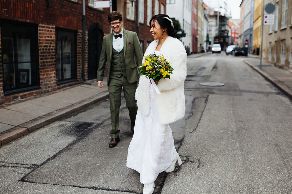 bride and groom in the streets of Copenhagen. Natural wedding photography in Copenhagen.