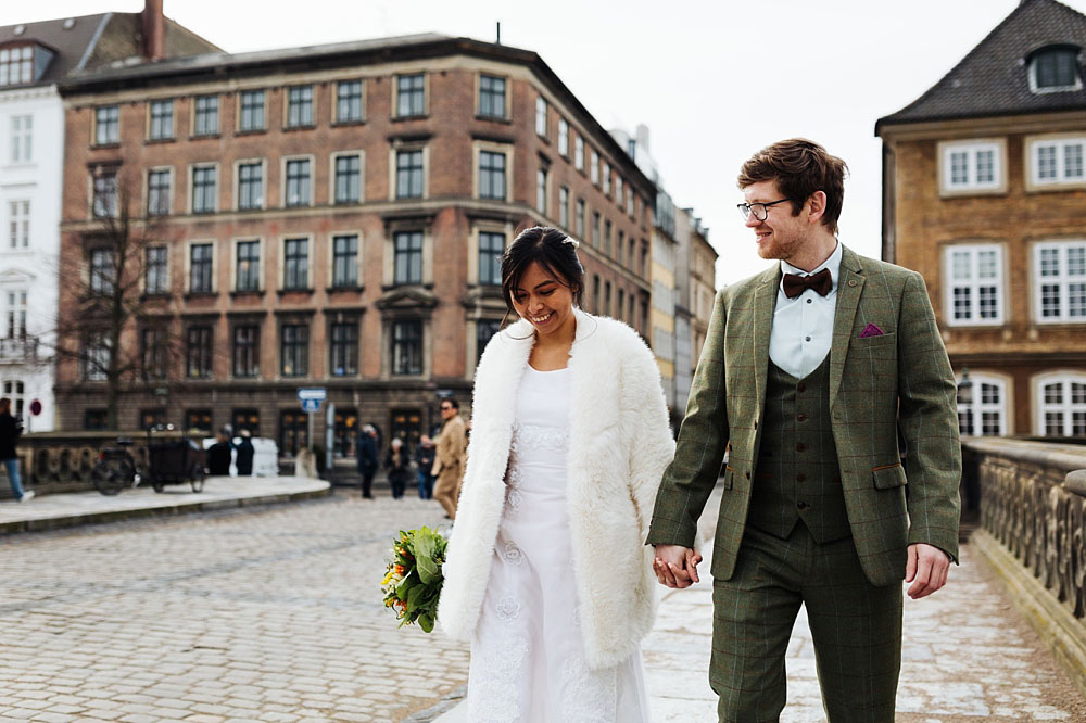 bride and groom in the streets of Copenhagen. Natural wedding photography in Copenhagen.