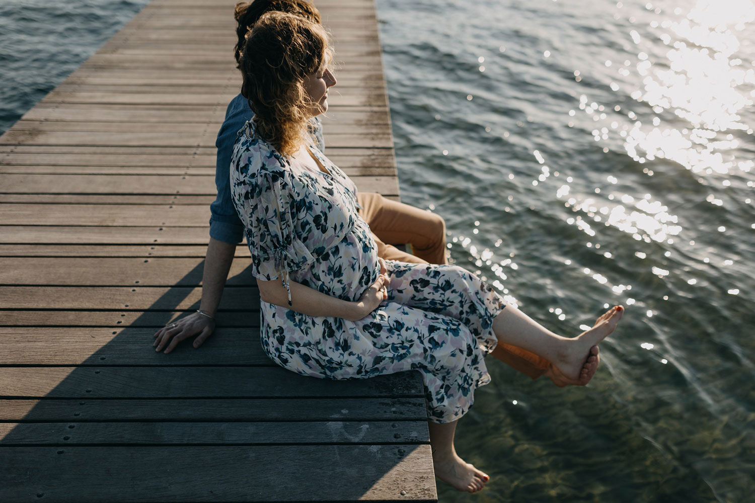 Beachside pregnancy photoshoot featuring the scenic views of Amager Strand in Copenhagen
