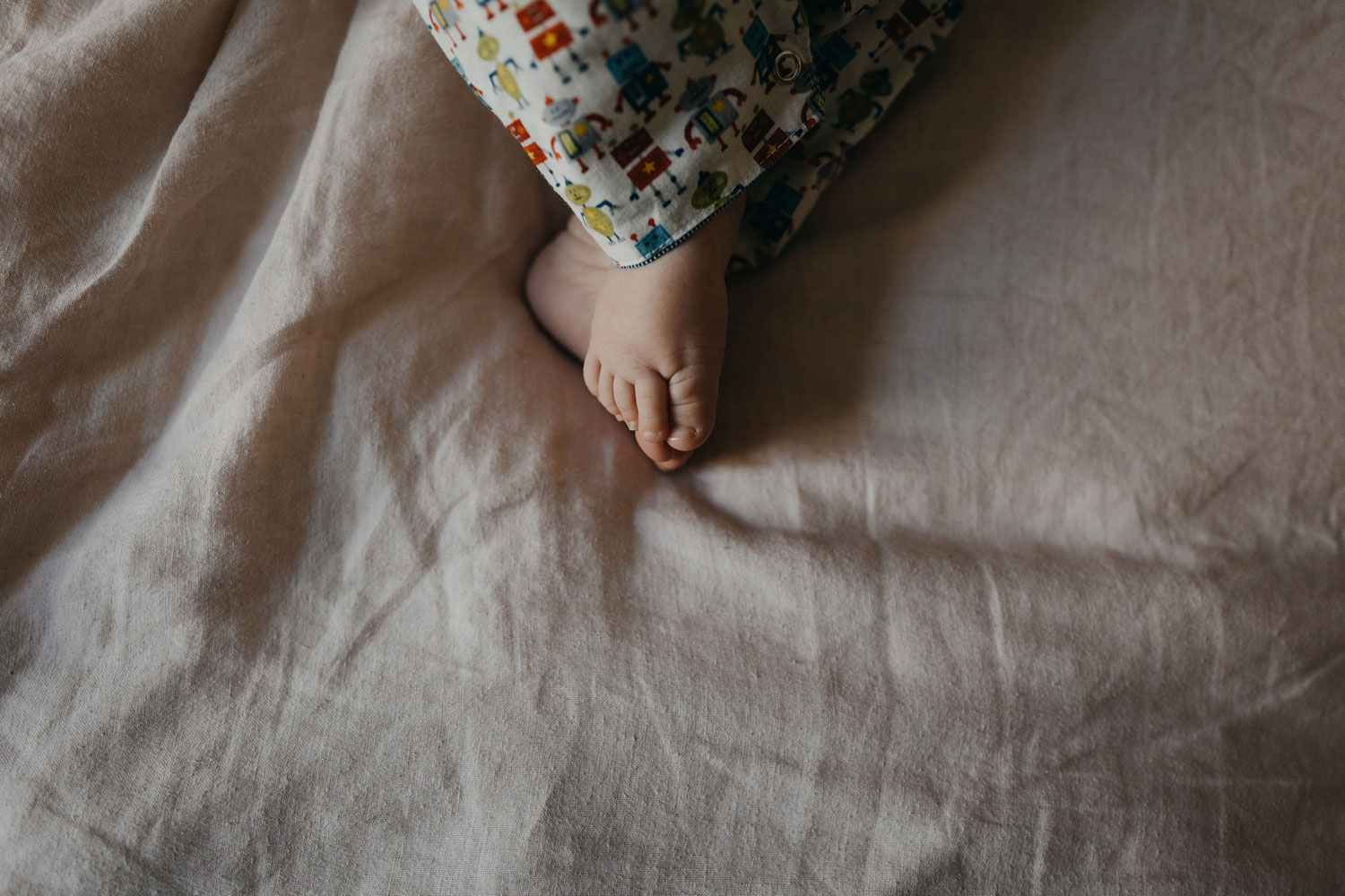 Image of a baby's chubby feet, captured during a professional baby photoshoot in Copenhagen