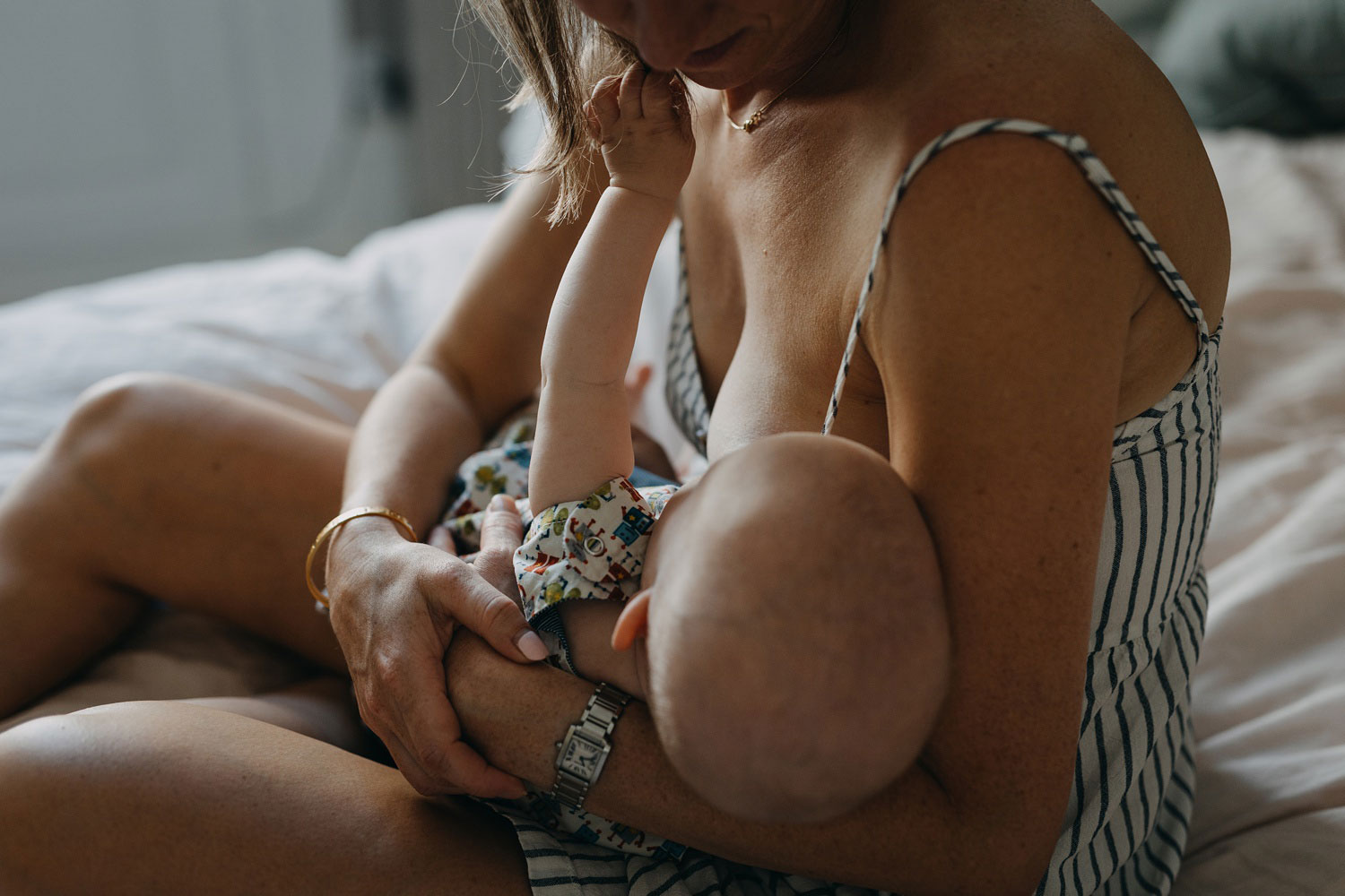 Copenhagen-based baby photographer captures precious moments of a baby being breastfed 