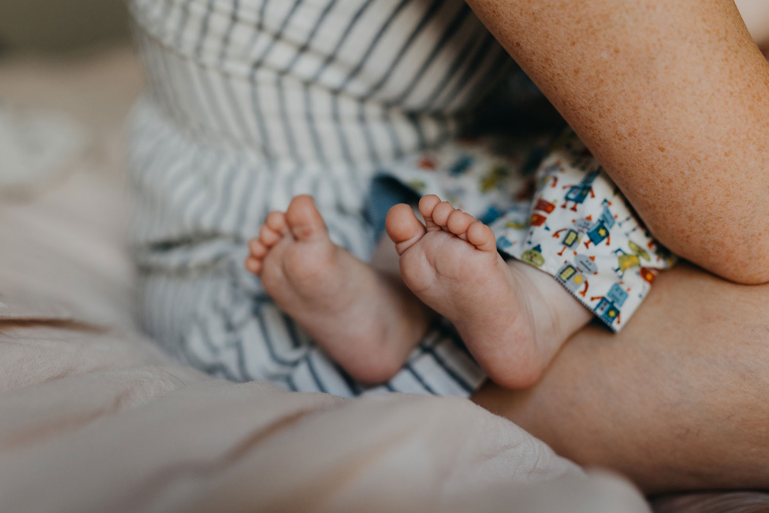 Adorable chubby baby feet captured in a close-up during a heartwarming photoshoot in Copenhagen