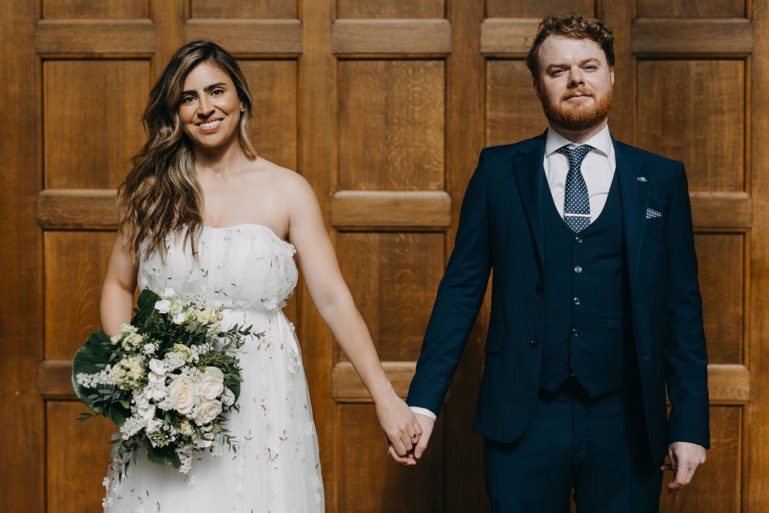 bride and groom holding hands at Copenhagen City Hall