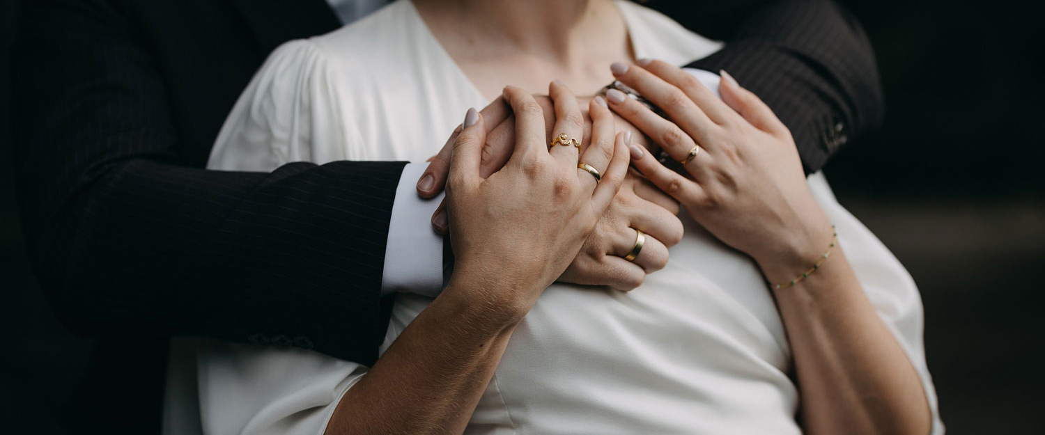 Copenhagen wedding photographer: details of two hands wearing their wedding rings