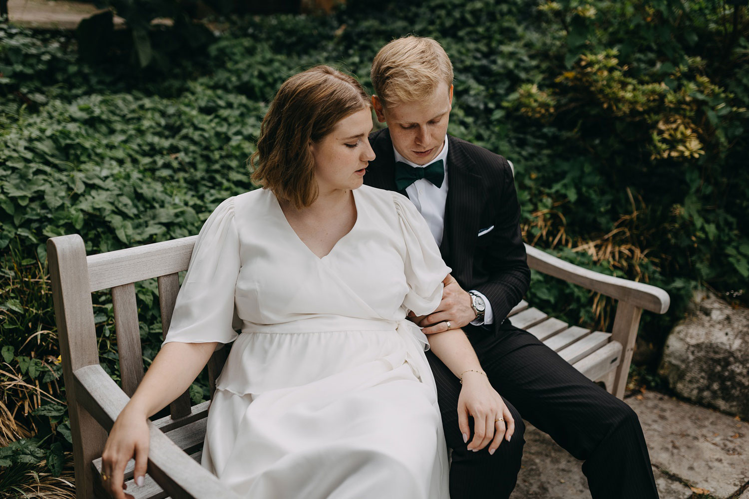 Happily married couple capturing a beautiful memory amidst the greenery of Frederiksberg Have