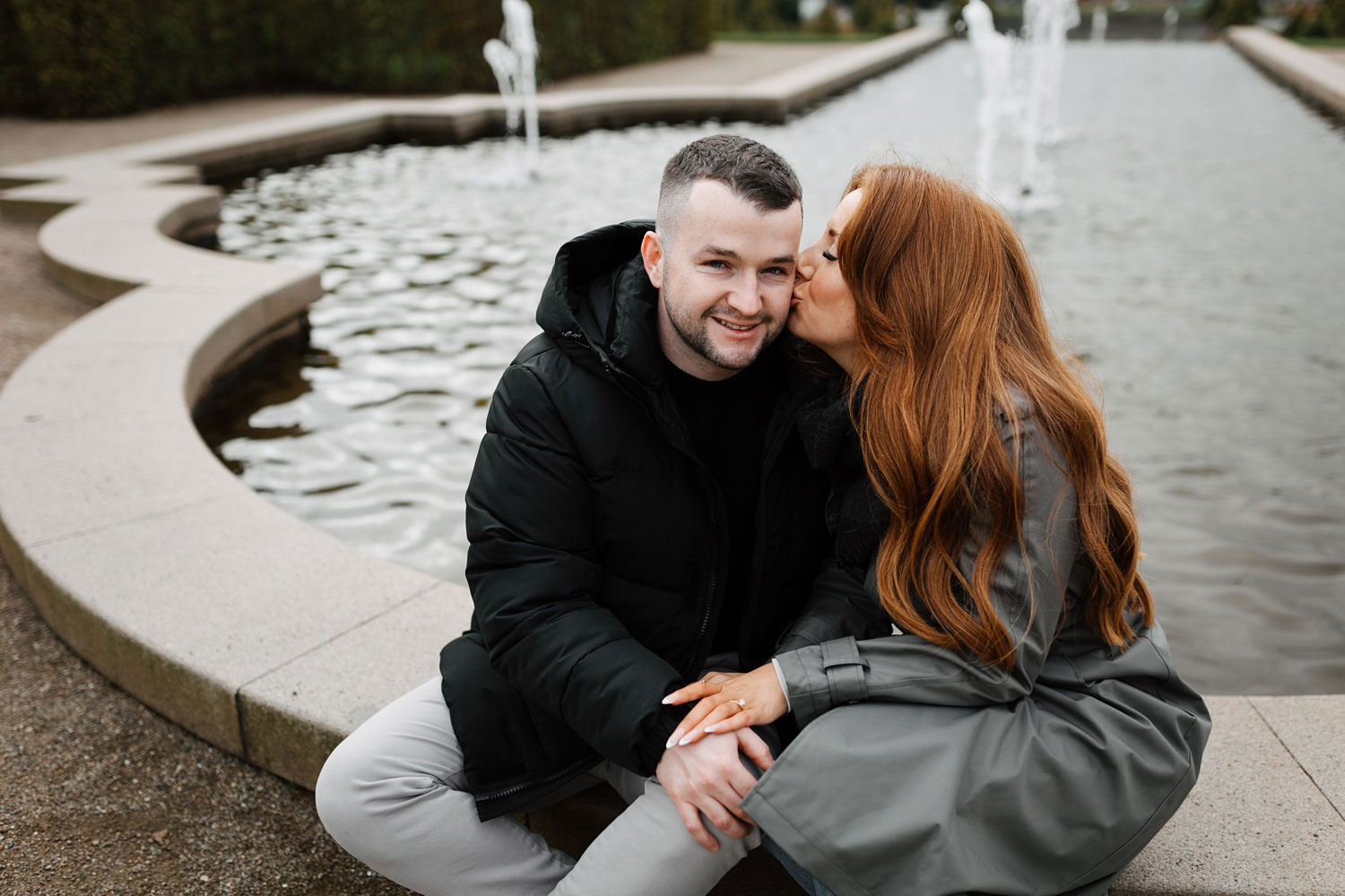 engagement photos by the fountain at Frederiksborg Castle in Hillerød