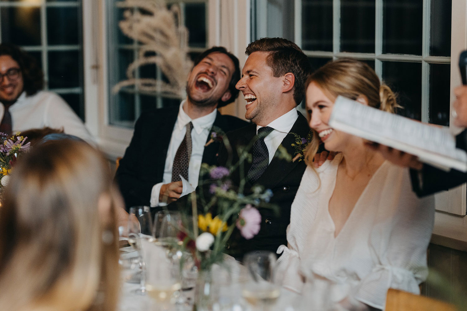 Warm moments as guests share laughter and joy during the heartfelt reception at Helenekilde Badehotel in Tisvildeleje