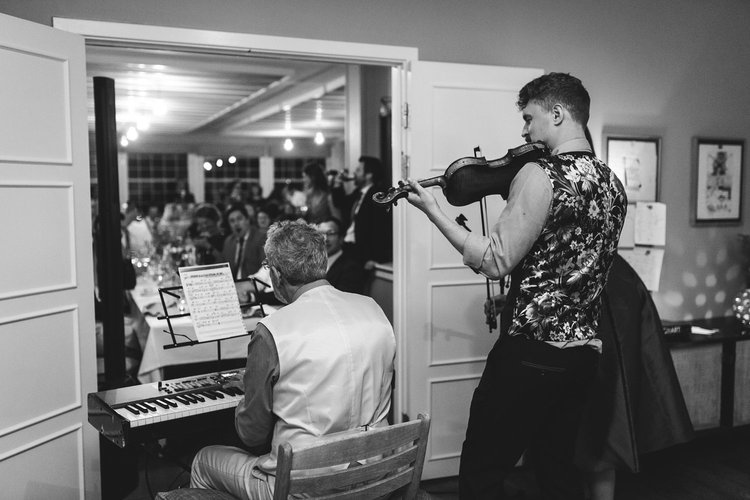 guests playing music for the newlyweds and their guests