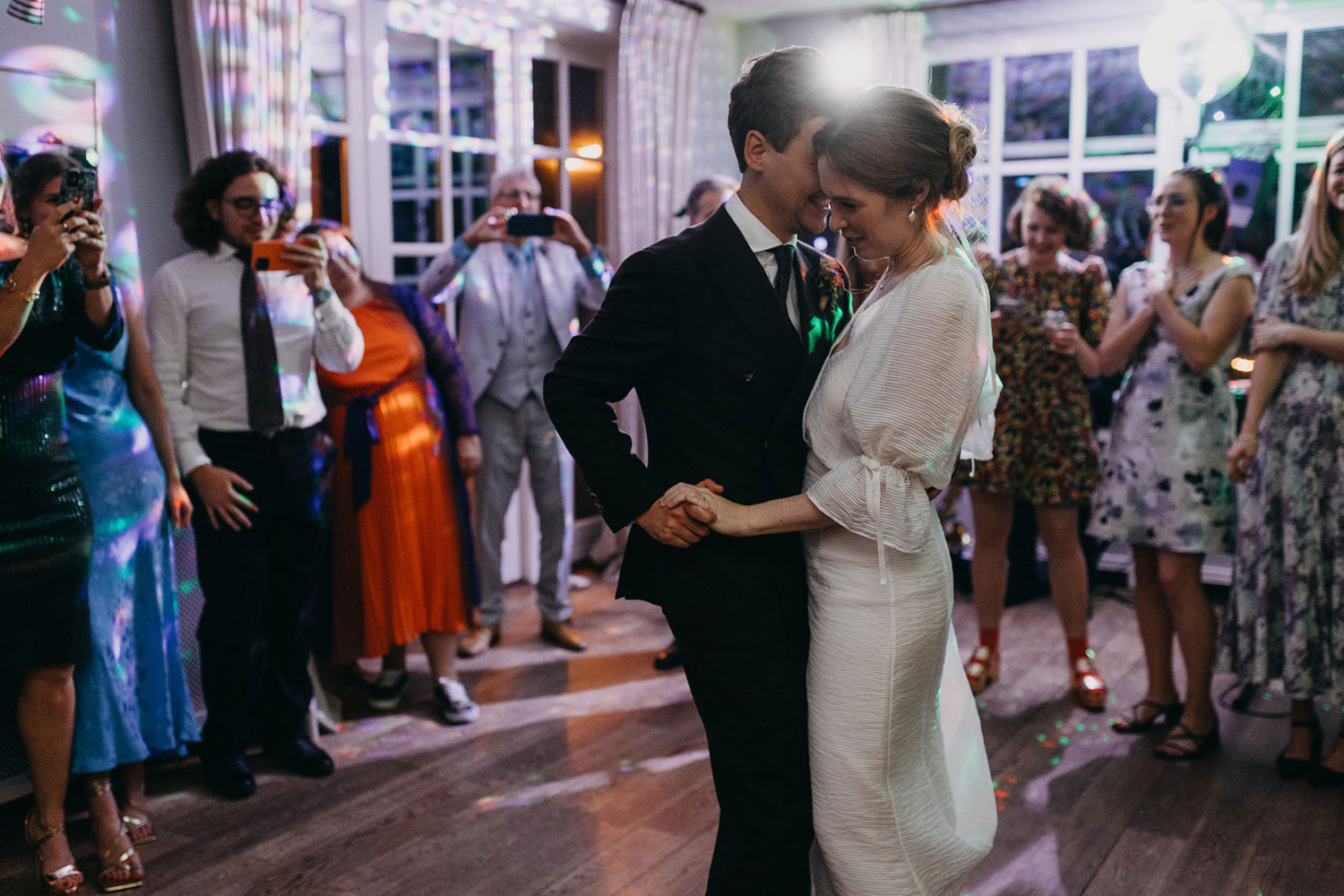 Intimate first dance moments as the couple celebrates their love at Helenekilde Badehotel