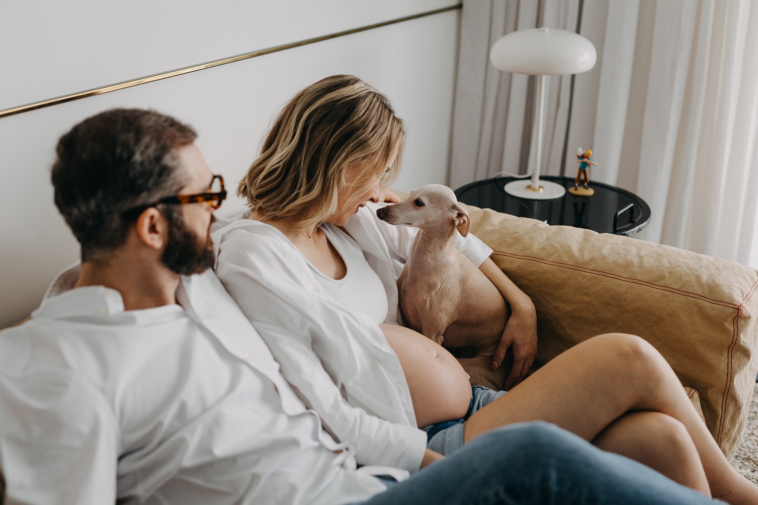 Pregnant woman and her dog sharing a special moment