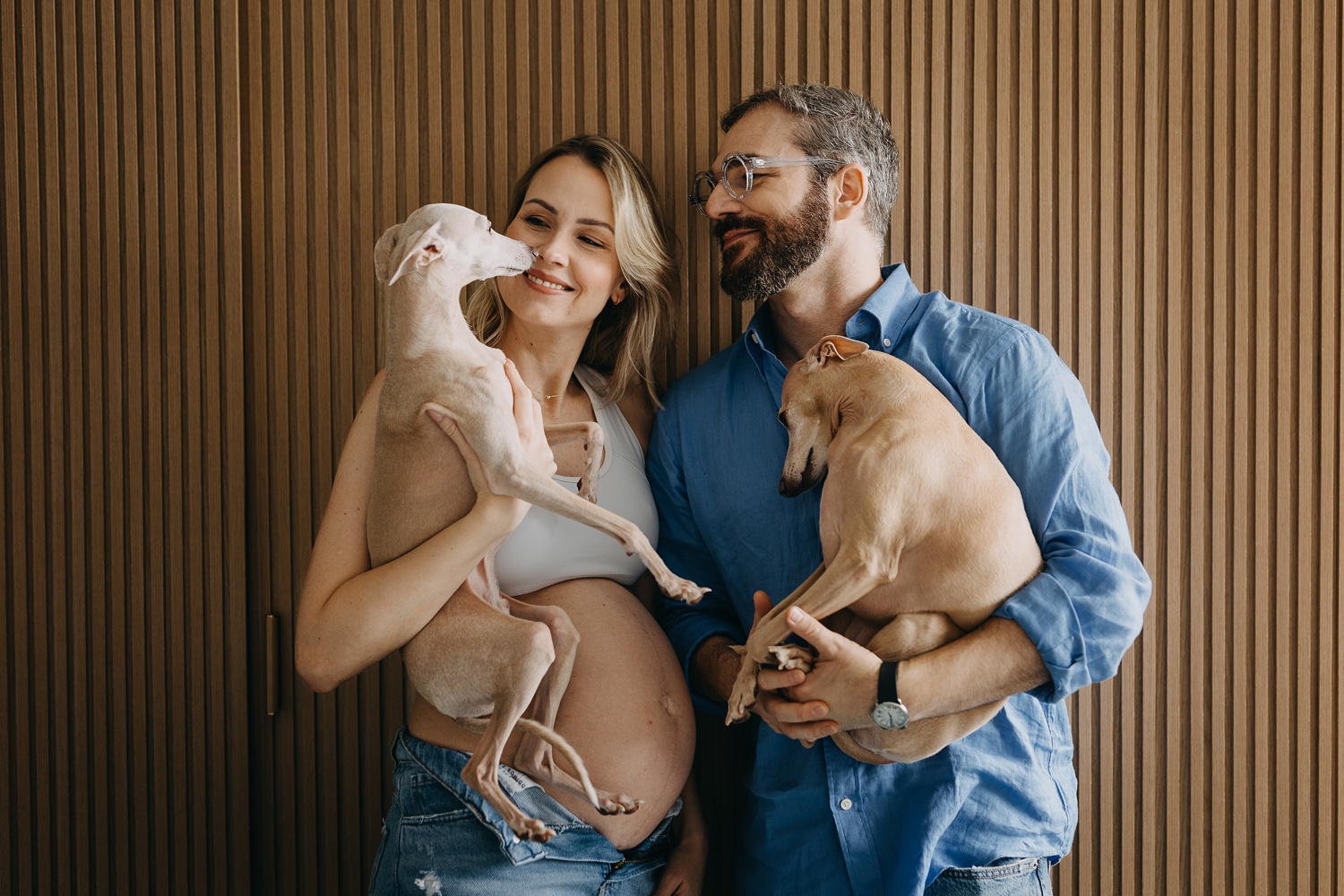 Cherished moments of pregnancy surrounded by the warmth of home and the companionship of two sweet Italian Greyhounds