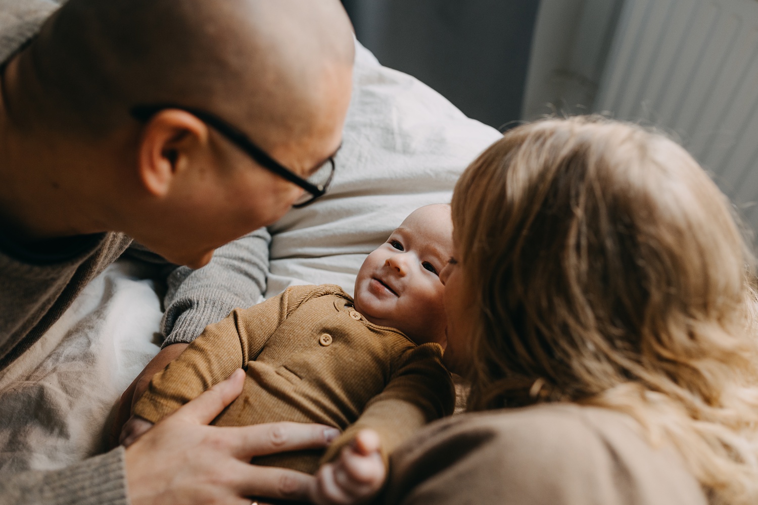 Loving parents with baby at home in Copenhagen