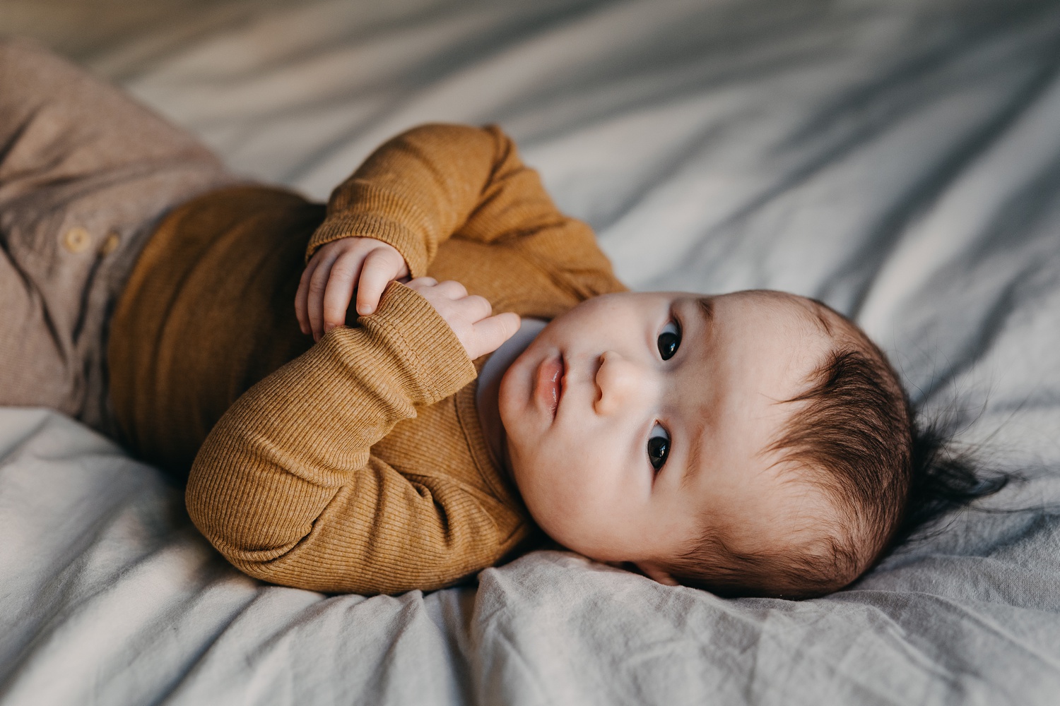 Expressive baby eyes in family session in Copenhagen