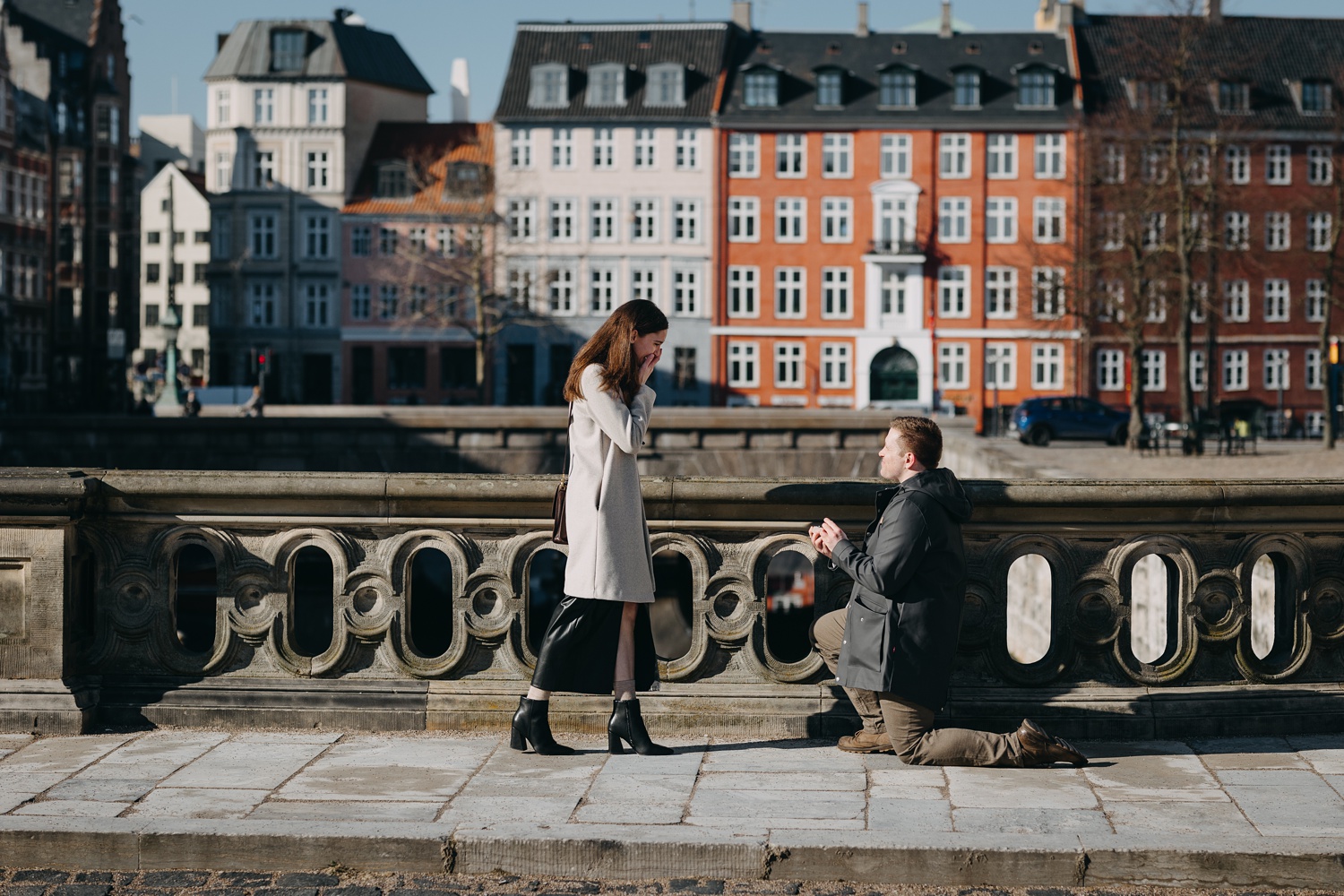 Memorable surprise proposal moment near iconic landmarks in Copenhagen