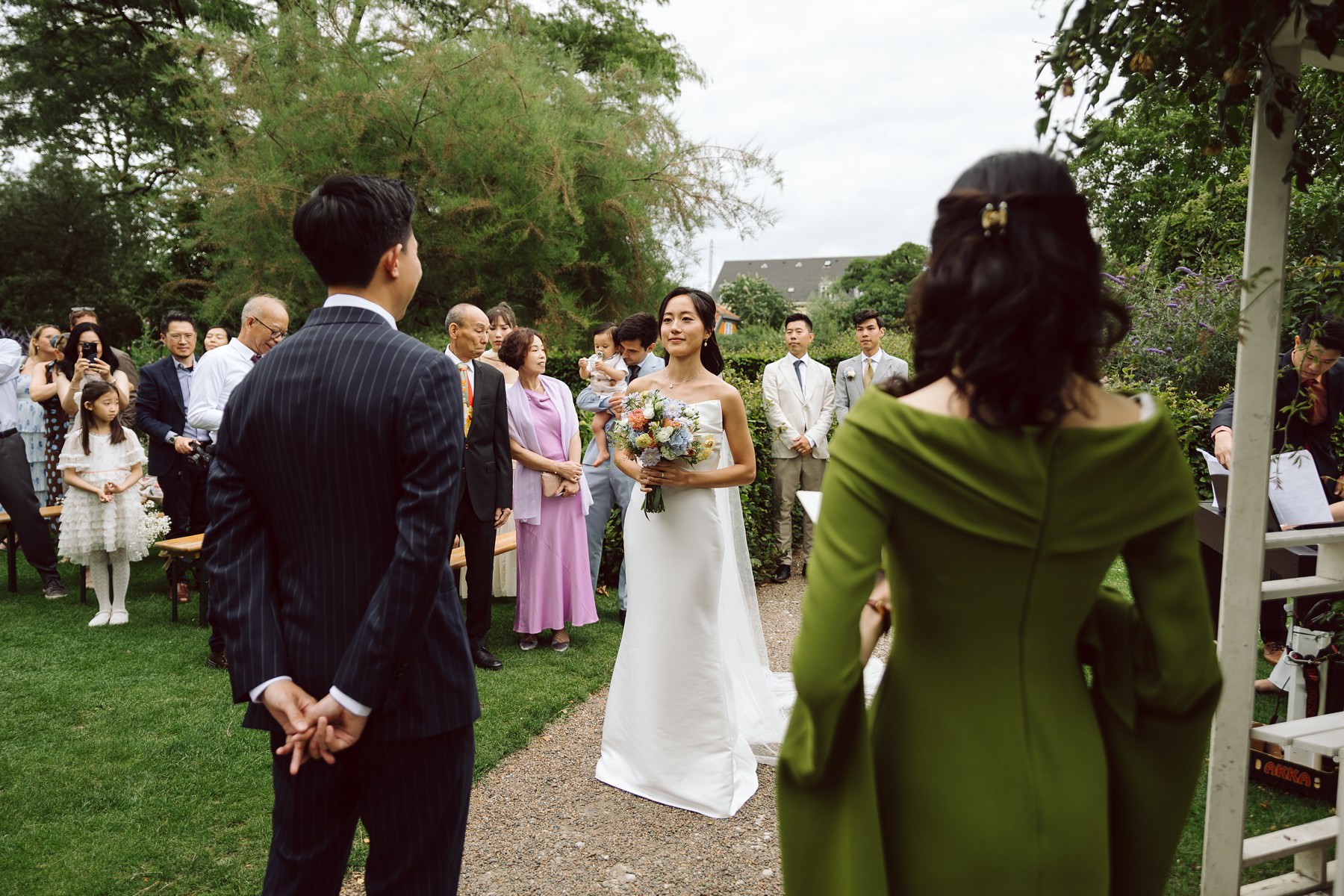 Wedding ceremony in a lush garden venue in Copenhagen.