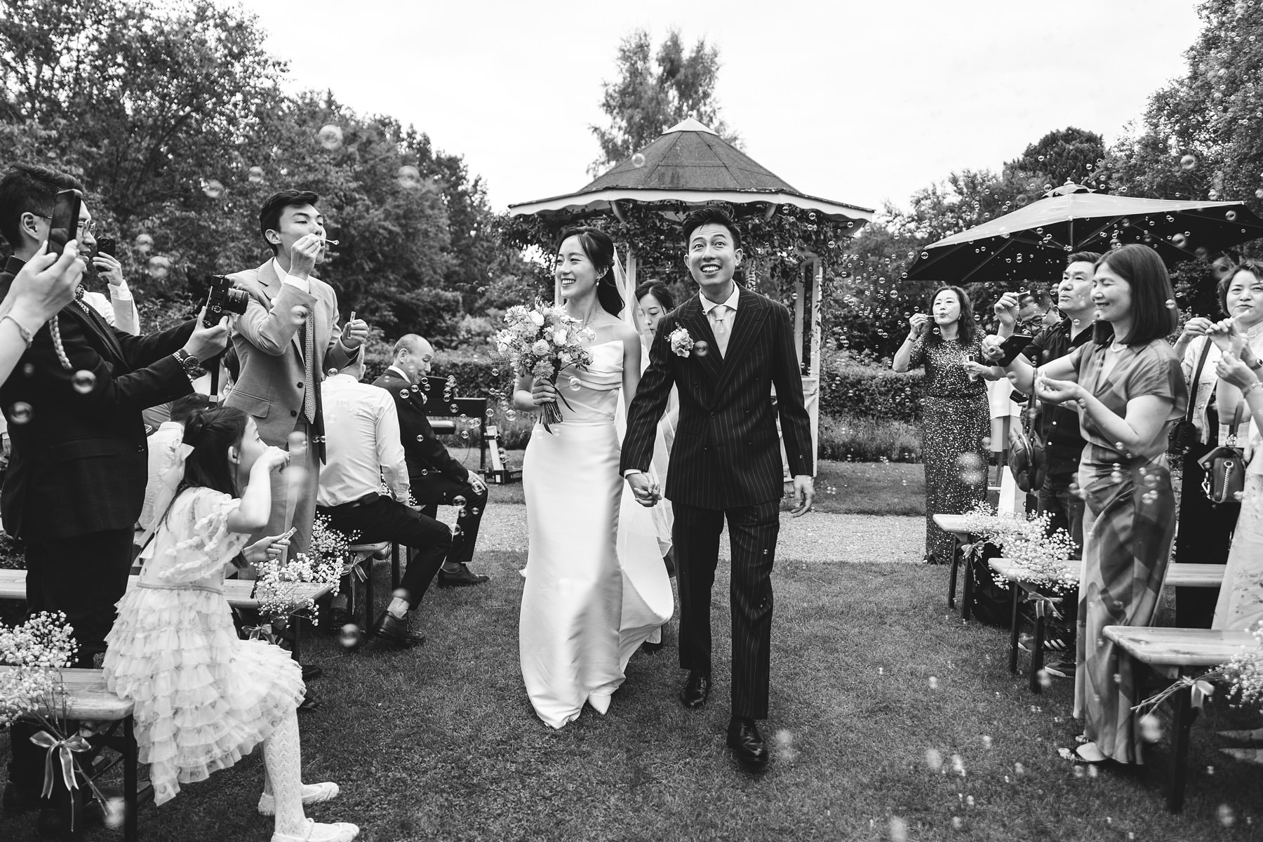 bride and groom walking down the aisle at an open-air ceremony in Copenhagen