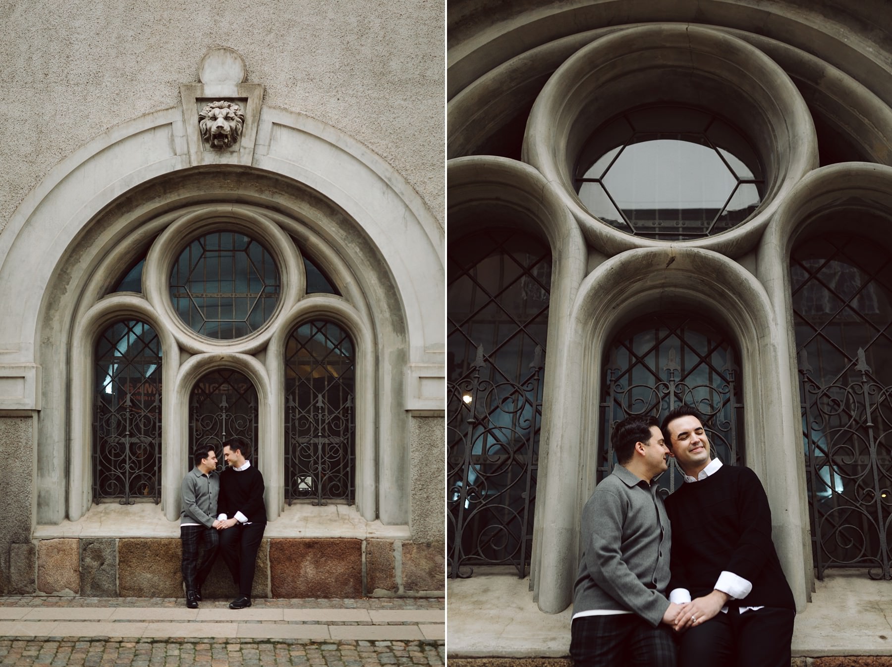 couple posing for engagement photos in front of a big beautigul window in Copenhagen