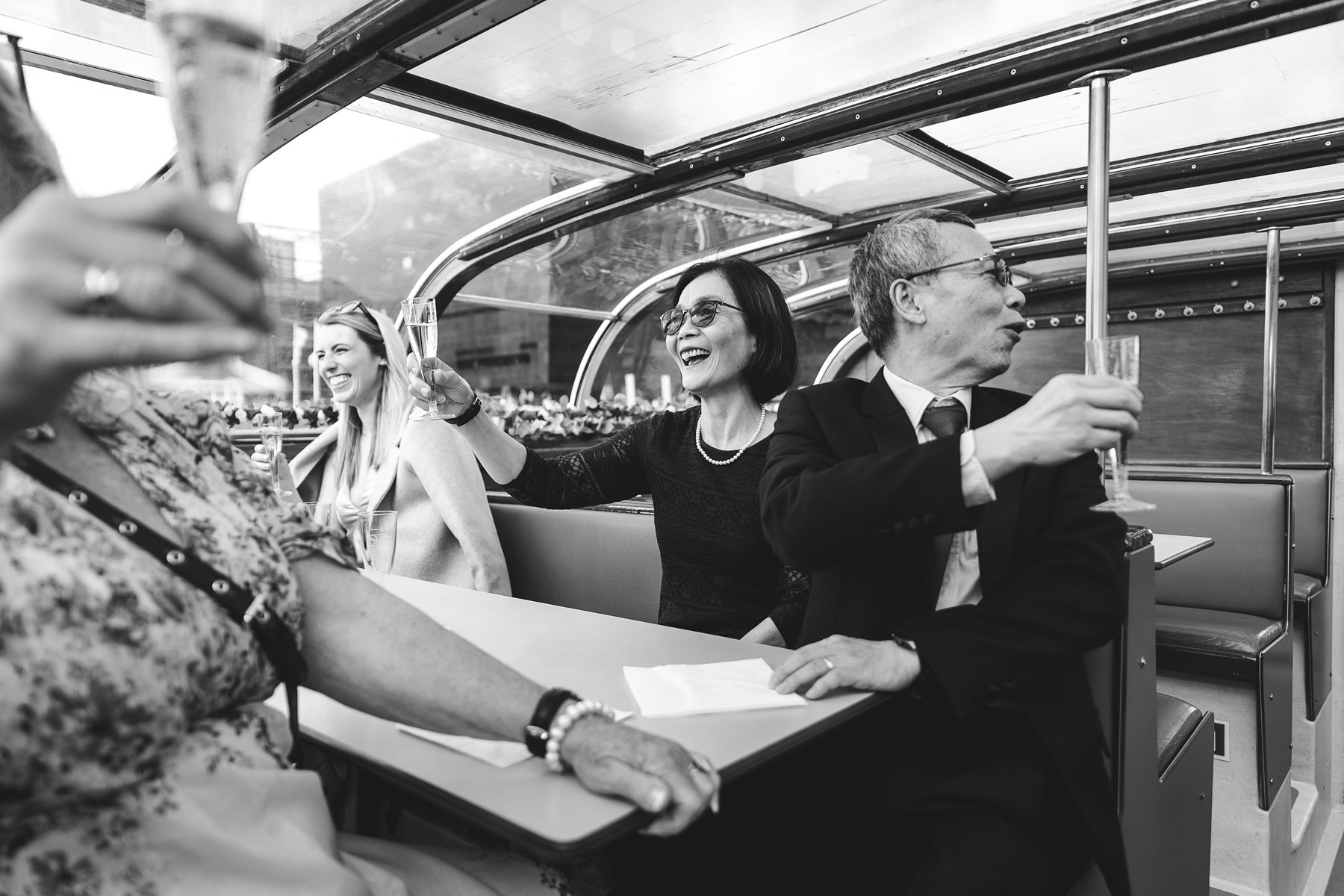 Copenhagen wedding canal boat tour with guests cruising past the harbor