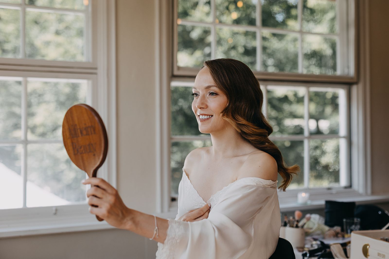 Bride getting ready in soft natural light before her wedding in Copenhagen