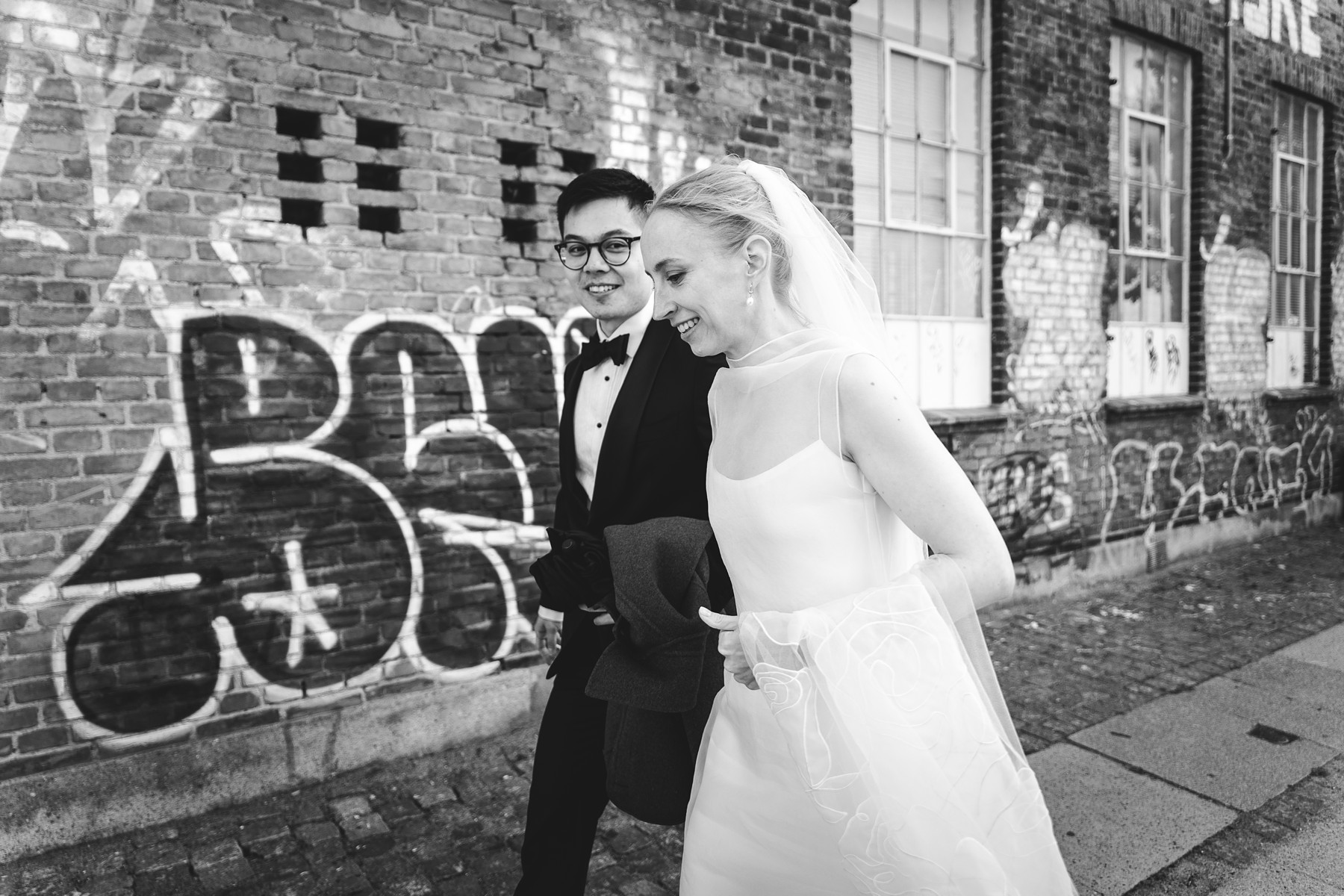 Bride and Groom short walk to Mogens Dahl Concert Hall for their wedding reception
