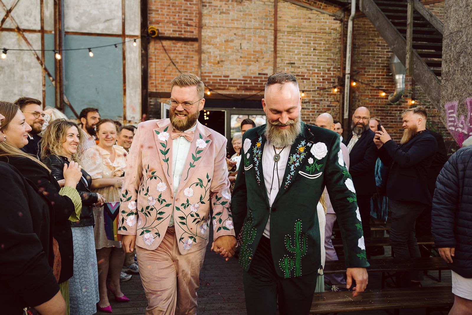 same-sex couple during an outdoor wedding ceremony at AFKROG Reffen in Copenhagen.