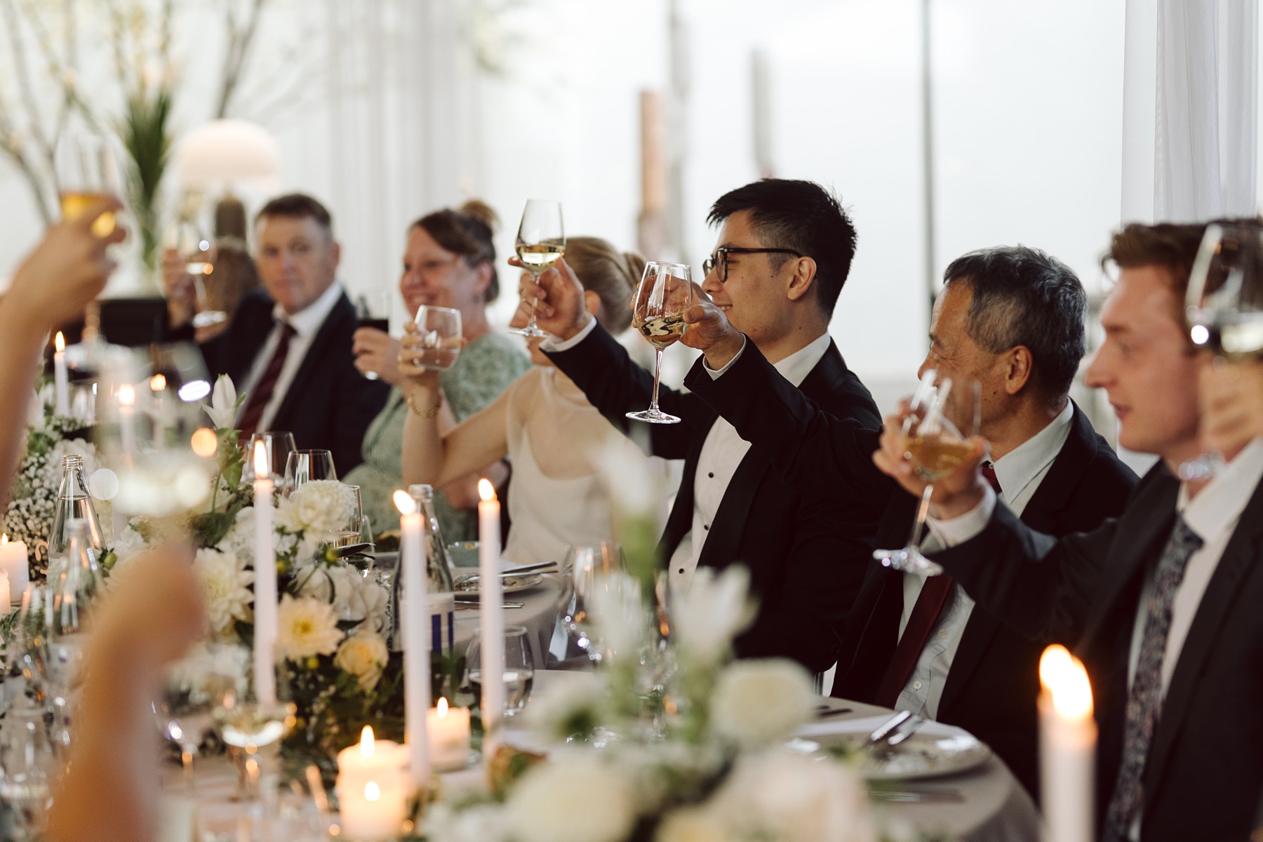 Newlyweds toasting during their intimate wedding celebration in Copenhagen