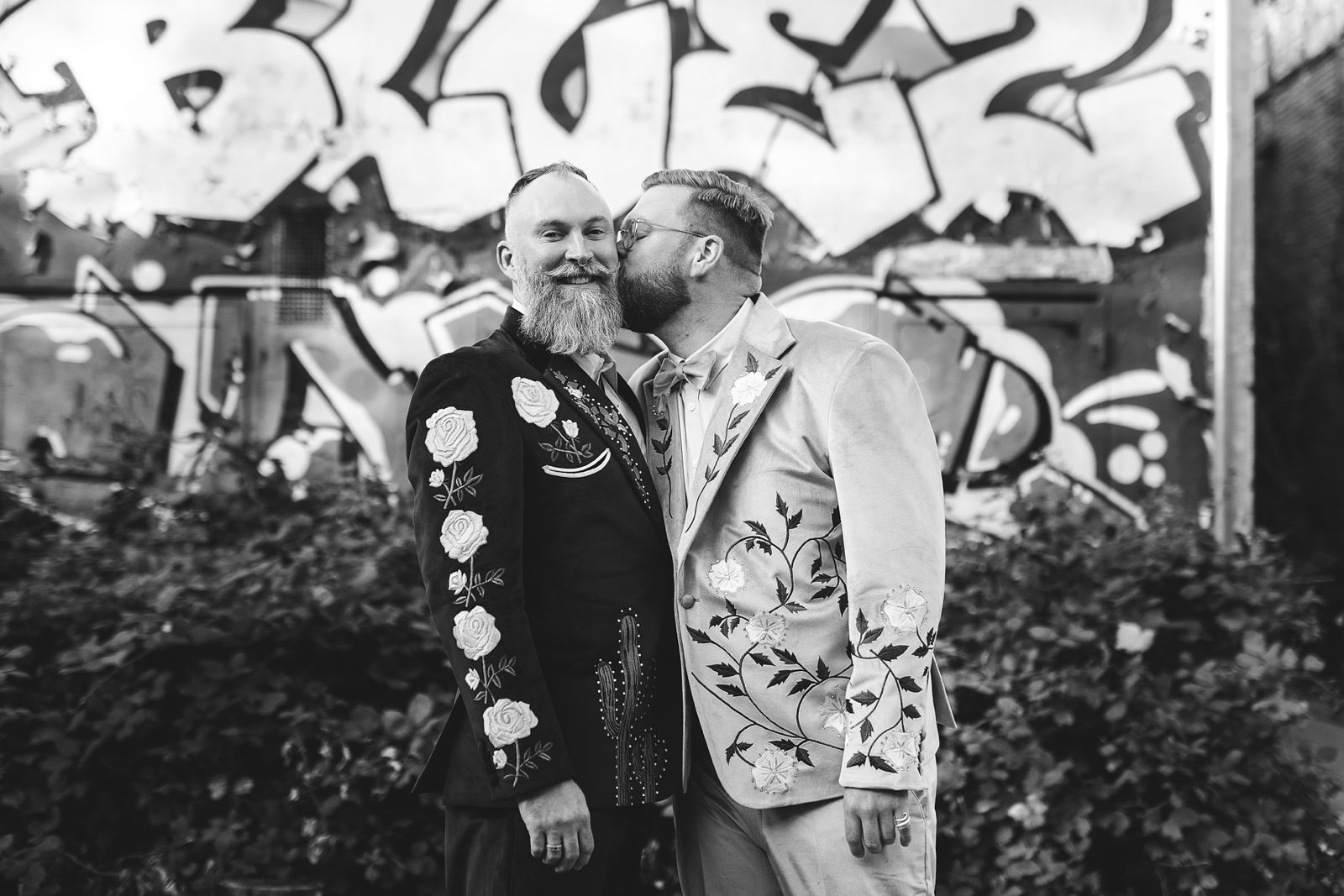 same-sex couple posing for wedding photos after their wedding ceremony at AFKROG Reffen