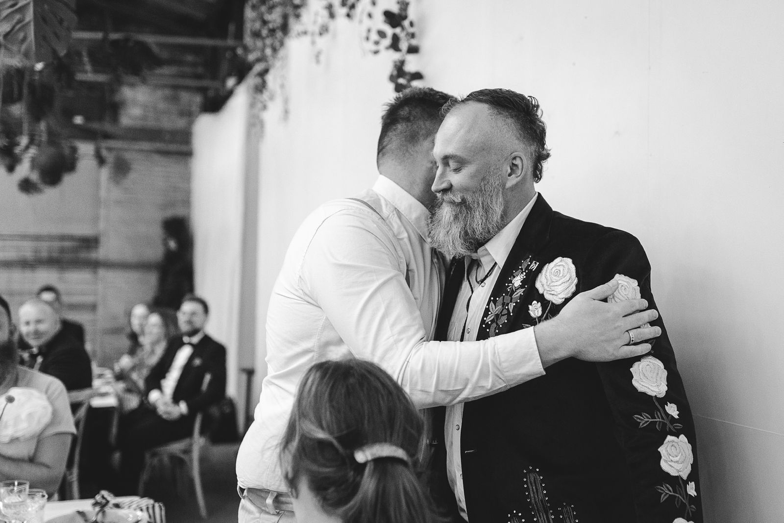 Emotional moment between couple during dinner at AFKROG Reffen in Copenhagen.