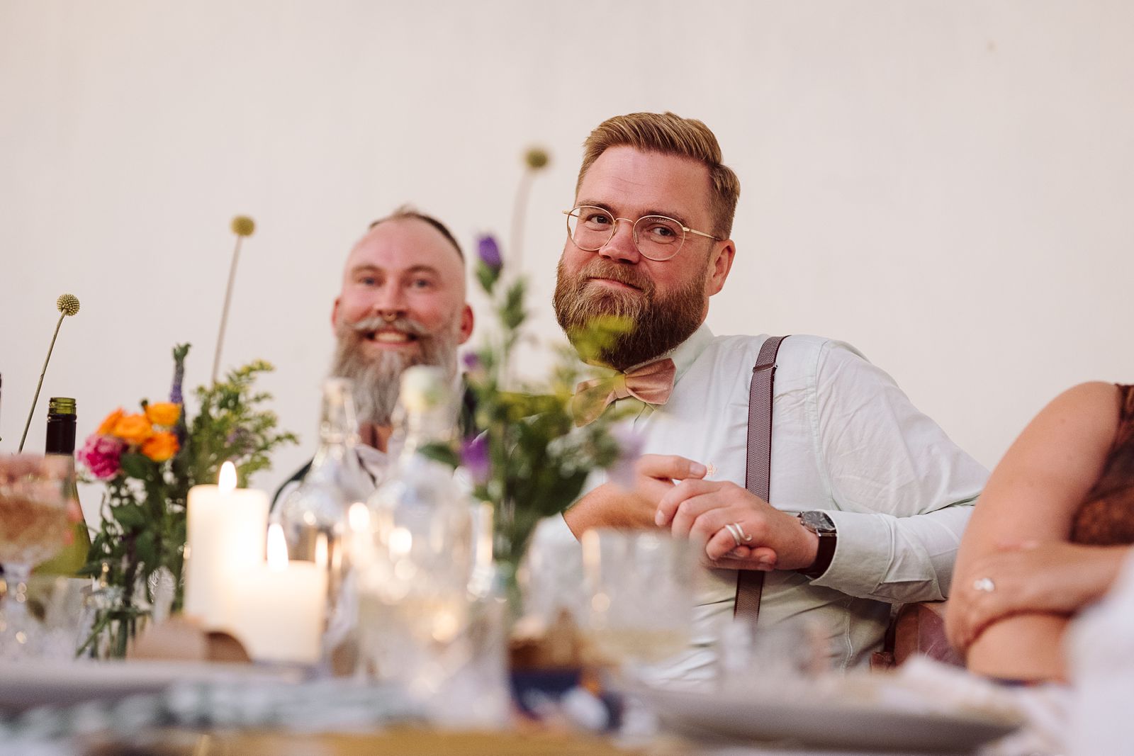Couple listening to speeches during their wedding celebration at AFKROG Reffen.