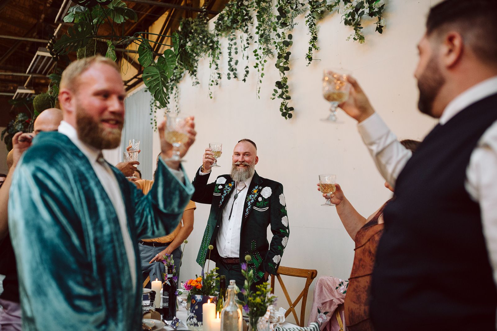 Couple toasting during their wedding celebration at AFKROG Reffen.