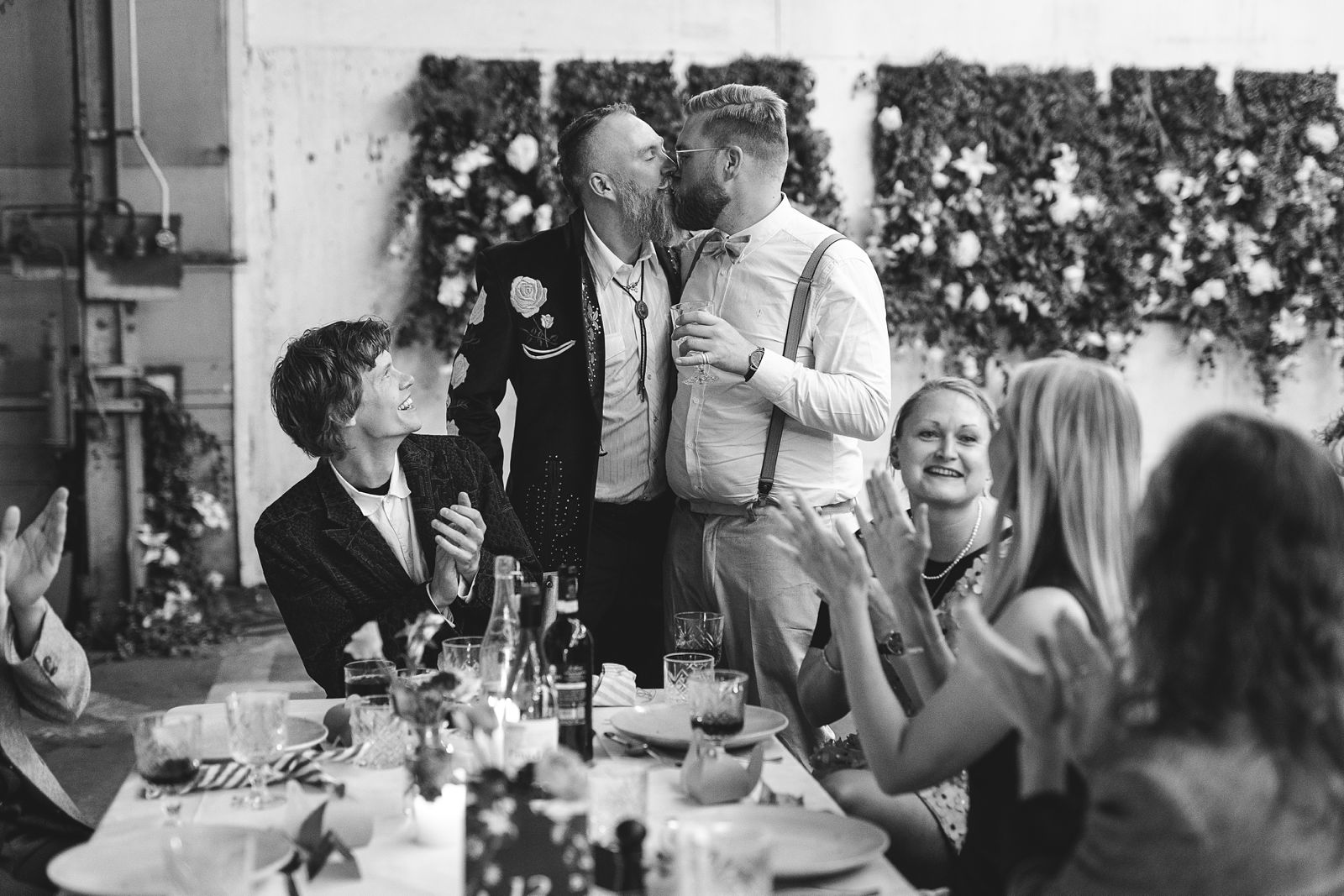 Couple kissing during their wedding celebration at AFKROG Reffen.