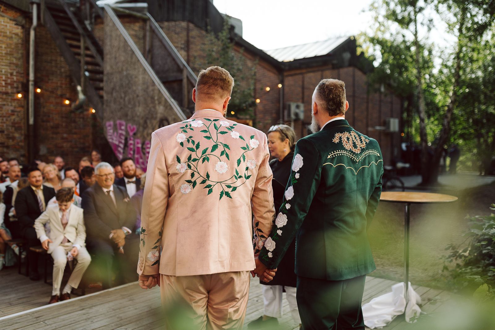 Same-sex couple getting married during a relaxed summer ceremony at AFKROG Reffen